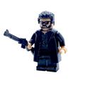 A custom-built toy minifigure of a man with black hair, sunglasses, and a black coat holding a gun, isolated on a white background.