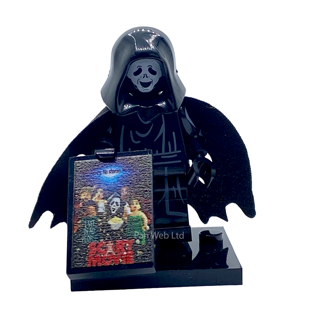 A black LEGO-style grim reaper minifigure with a skull face and bat-like wings, standing on a glossy black base next to a small rectangular display card featuring Star Wars imagery.