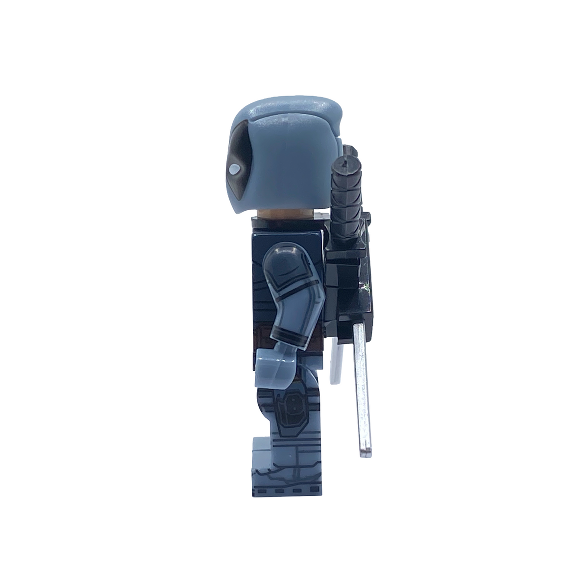 Side profile of masked X-Force Deadpool custom minifigure showing grey suit and back-mounted swords
