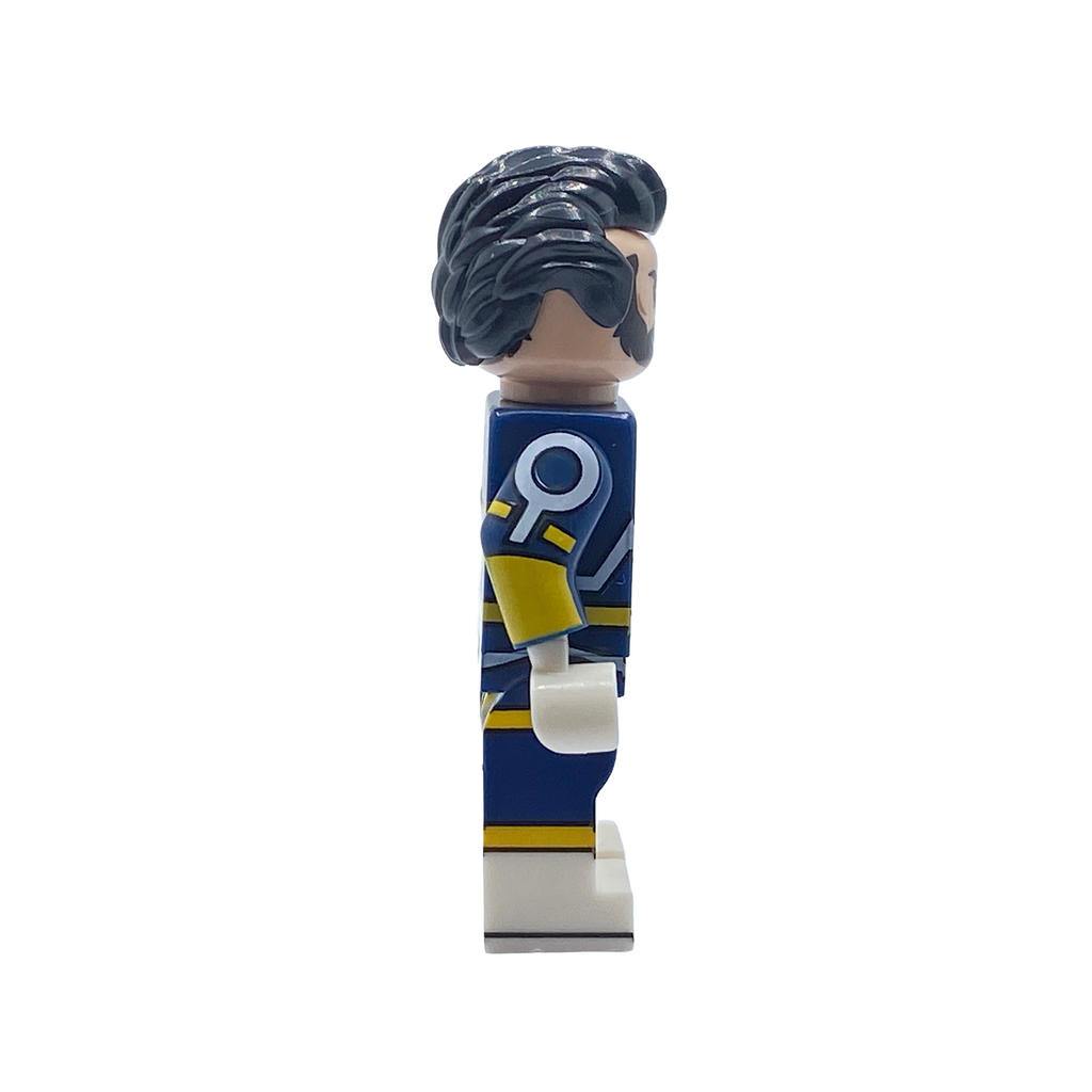 Side profile of The Immortal custom minifigure showing dark hair and the navy, yellow and gold suit