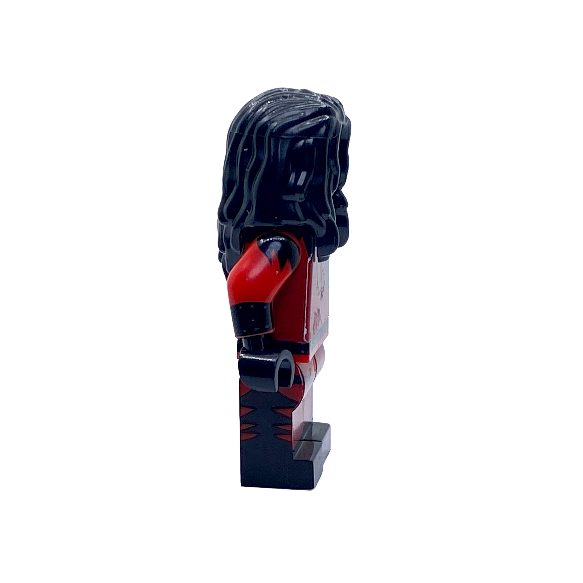 Side profile of the Kane WWE custom minifigure showing the long black hair, red-and-black mask and wrestling outfit.