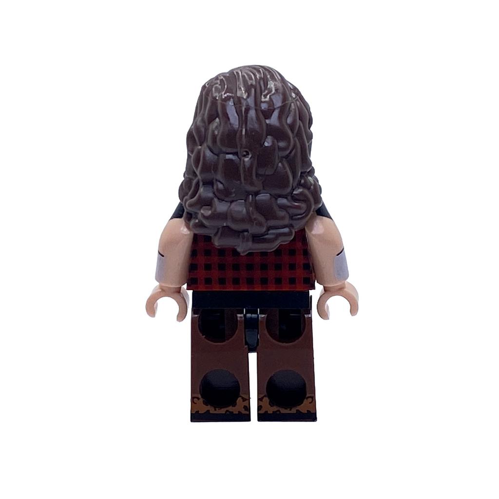 Rear view of the Mick Foley Cactus Jack custom minifigure showing long curly brown hair, the plaid shirt and brown printed trousers.
