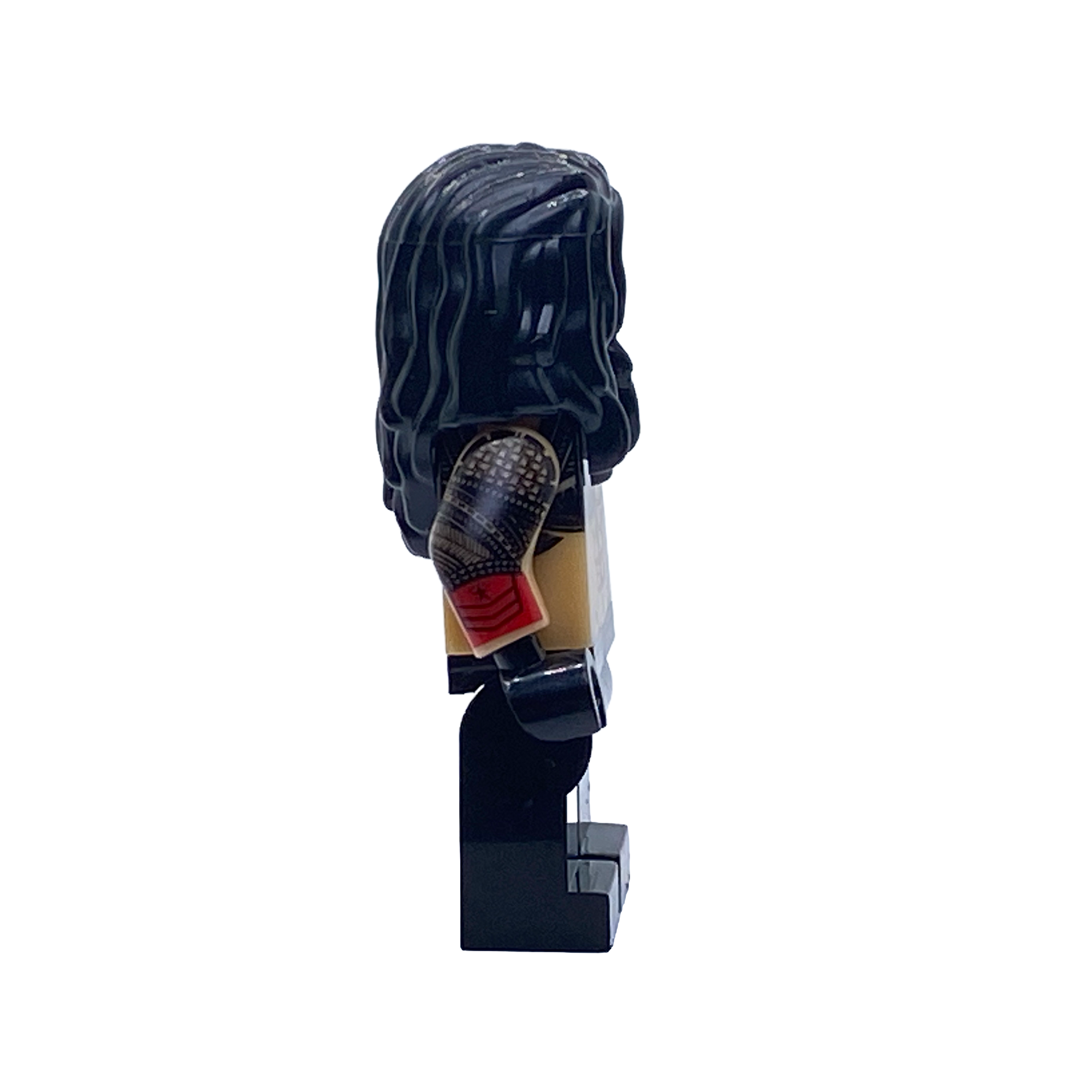 Side profile of the Roman Reigns WWE custom minifigure showing long black hair, a tattooed arm, red glove and black ring trousers.