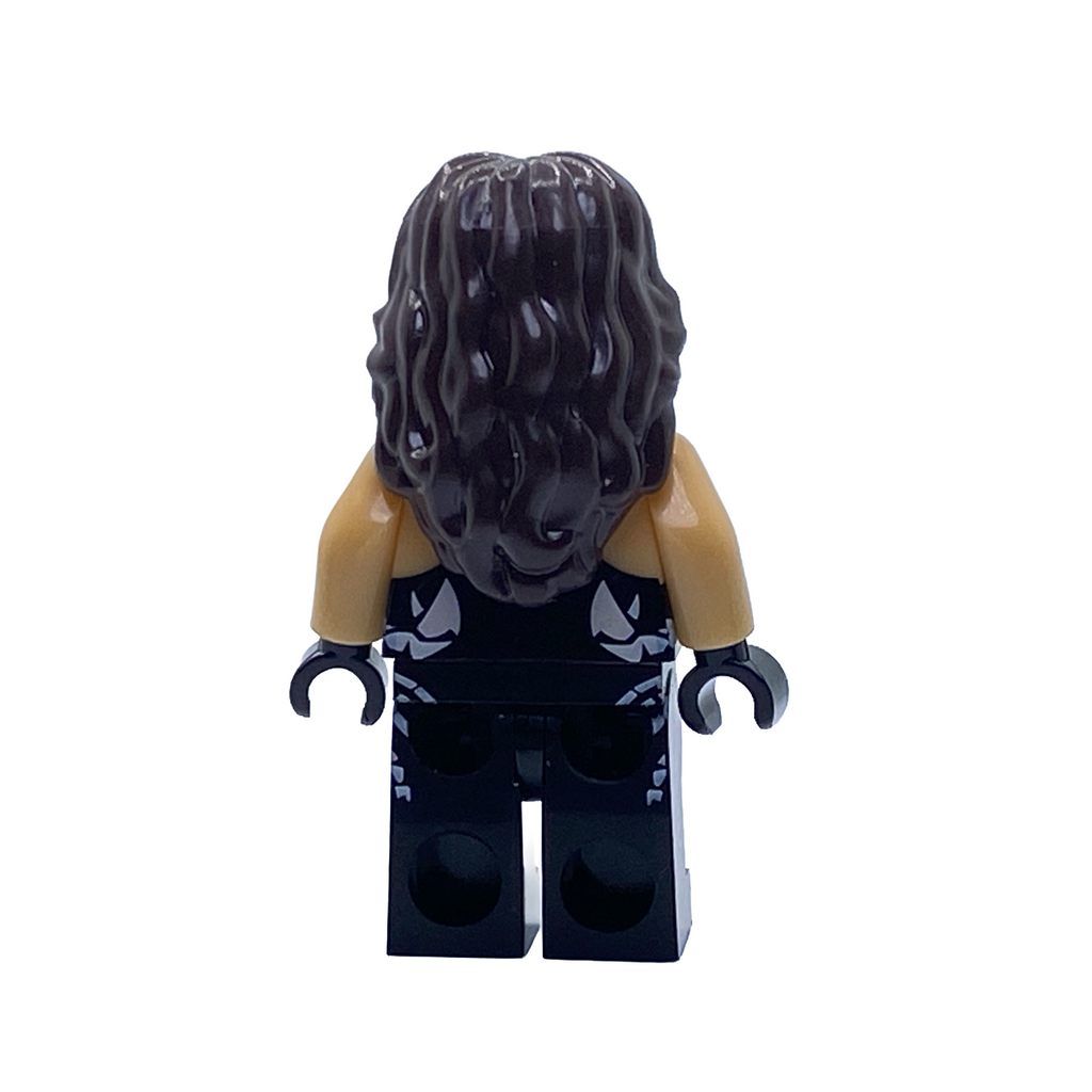 Rear view of the Sting WWE custom minifigure showing long textured black hair and white skull details on the all-black wrestling gear.